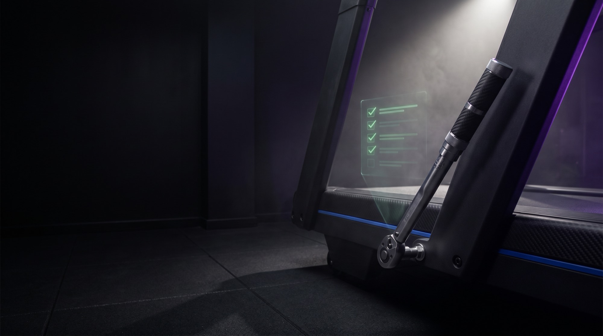 Technician running preventative diagnostics on gym equipment